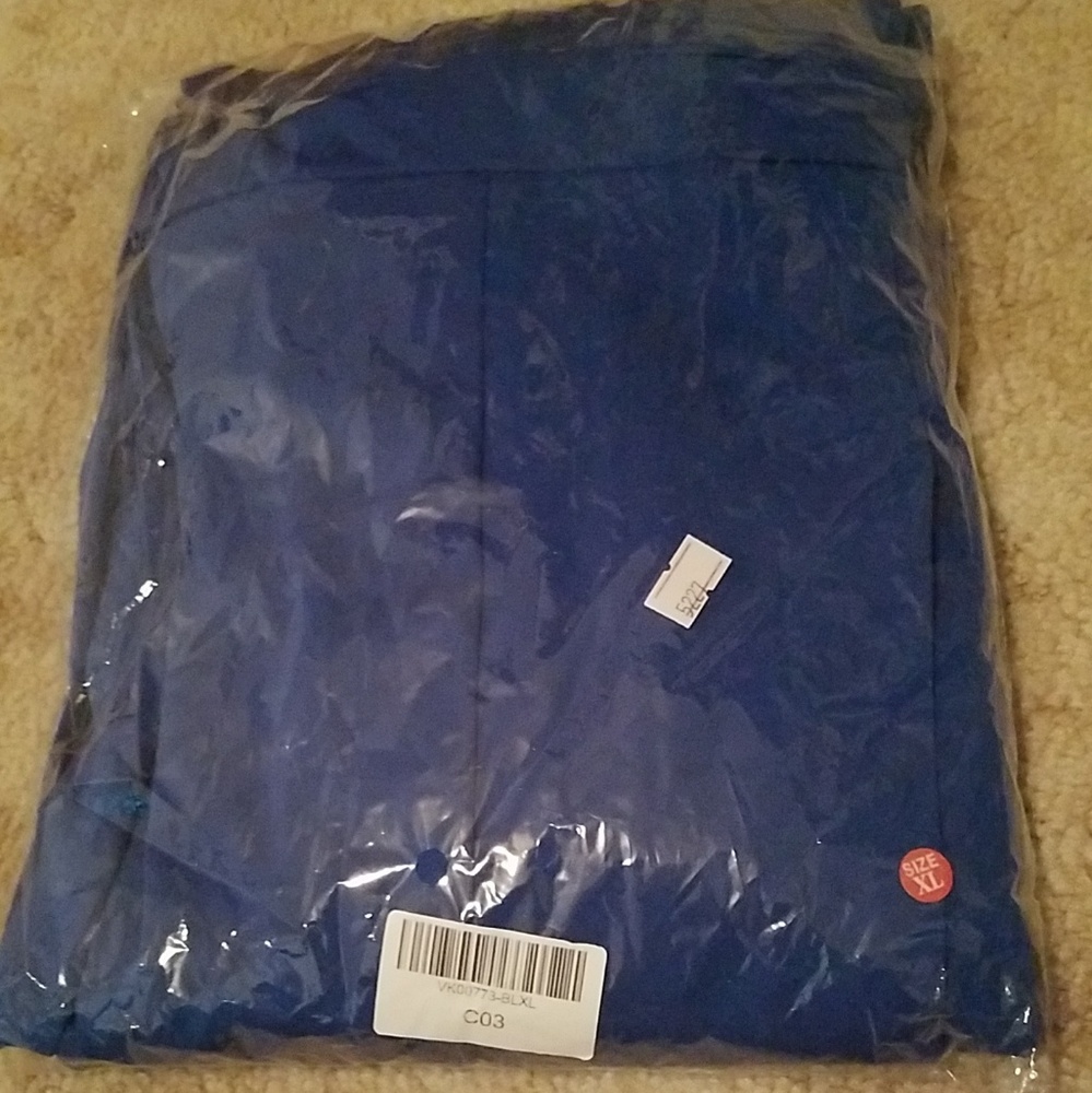 A very beautiful shade of blue, arm Cape jumpsuit.